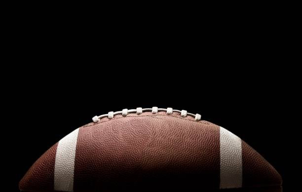 American football ball on background